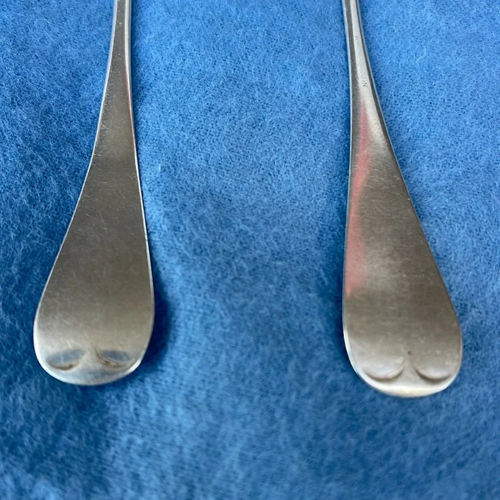 Set of 2 antique spoons , stamped lion and sterling